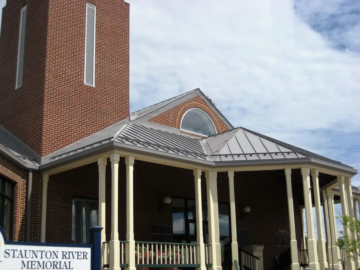Skilled roofing craftsmen working on a residential roof in Alabaster